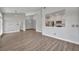 Bright and airy living room showcases light wood-look floors and an open-concept design at 104 Nautica Mile Dr, Clermont, FL 34711