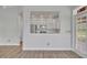 Open-concept living area showcasing a seamless flow into the kitchen with lots of natural light at 104 Nautica Mile Dr, Clermont, FL 34711