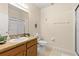 Clean bathroom featuring a single sink vanity and a glass-enclosed shower at 110 Watling Way # 25204, Davenport, FL 33837