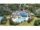Aerial view of an amazing community clubhouse pool area with lounge chairs and a hot tub at 110 Watling Way # 25204, Davenport, FL 33837