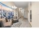 Comfortable hallway with a mural, neutral tones, carpet flooring, and multiple doors to other rooms at 110 Watling Way # 25204, Davenport, FL 33837