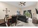 Open-concept living and dining area features comfortable seating, modern accents and bright lighting at 110 Watling Way # 25204, Davenport, FL 33837