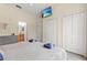 Bright main bedroom features ample closet space, neutral tones and a large window at 110 Watling Way # 25204, Davenport, FL 33837