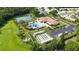 Aerial view featuring the community pool, tennis courts, shuffleboard and convenient parking at 11412 Stamfield Dr, Orlando, FL 32821