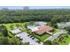 Aerial view of community amenities featuring a pool, tennis courts, and lush landscaping at 11412 Stamfield Dr, Orlando, FL 32821