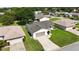 Aerial view of home highlighting the driveway and landscaping at 11412 Stamfield Dr, Orlando, FL 32821