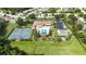 Aerial view featuring the community pool, tennis courts, shuffleboard, clubhouse and convenient parking at 11412 Stamfield Dr, Orlando, FL 32821