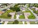 Aerial view showcasing home's manicured lawn, driveway, and street appeal at 11412 Stamfield Dr, Orlando, FL 32821
