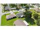 Aerial view of home showcasing the screened lanai, manicured lawn, and neighborhood at 11412 Stamfield Dr, Orlando, FL 32821