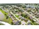 Neighborhood aerial view with mature landscaping, showcasing a home's location with nearby lakes and amenities at 11412 Stamfield Dr, Orlando, FL 32821