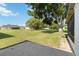 Expansive backyard featuring lush greenery and mature trees providing ample shade at 11412 Stamfield Dr, Orlando, FL 32821
