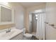 Bathroom with neutral paint, shower, and a white single sink vanity at 11412 Stamfield Dr, Orlando, FL 32821
