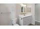 Bathroom features a single sink vanity and an over-the-toilet shelving at 11412 Stamfield Dr, Orlando, FL 32821