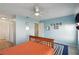 Bedroom with blue walls, white trim, carpet, and ceiling fan at 11412 Stamfield Dr, Orlando, FL 32821