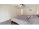 Bedroom with tile floors, ceiling fan and ensuite bathroom at 11412 Stamfield Dr, Orlando, FL 32821