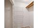 Walk-in closet featuring built-in shelving for organization at 11412 Stamfield Dr, Orlando, FL 32821