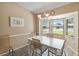 Bright dining area featuring a bay window and seating for four at 11412 Stamfield Dr, Orlando, FL 32821