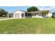 Well-manicured lawn leads up to this single-story home with a two-car garage at 11412 Stamfield Dr, Orlando, FL 32821