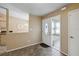 Entryway showing tile flooring, glass storm door, and a view into the dining area at 11412 Stamfield Dr, Orlando, FL 32821