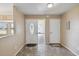 Inviting foyer features tile flooring, a decorative front door, and neutral paint at 11412 Stamfield Dr, Orlando, FL 32821