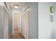 Hallway with access to the bathroom and closet with louvered doors at 11412 Stamfield Dr, Orlando, FL 32821