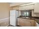 Practical kitchen offers a view into the backyard through the kitchen window at 11412 Stamfield Dr, Orlando, FL 32821