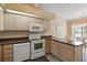 Bright kitchen with modern appliances, light wood cabinets, and a breakfast nook at 11412 Stamfield Dr, Orlando, FL 32821
