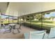 Covered lanai with outdoor seating, perfect for enjoying the surrounding green space at 11412 Stamfield Dr, Orlando, FL 32821