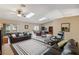 Bright living room with dual ceiling fans, skylights and tile floors at 11412 Stamfield Dr, Orlando, FL 32821