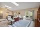Comfortable living room featuring skylights, tile floors and dual patio doors at 11412 Stamfield Dr, Orlando, FL 32821