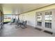 Relax on the screened patio with dining set and lounge chairs at 11412 Stamfield Dr, Orlando, FL 32821