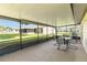 Enjoy the views from the covered lanai with screened enclosure and outdoor seating at 11412 Stamfield Dr, Orlando, FL 32821