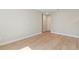 Spacious bedroom featuring hardwood floors, neutral wall color, and natural light at 1217 Cloverlawn Ave, Orlando, FL 32806