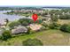 Aerial view of home with a pool and waterfront view at 1319 Johns Cove Ln, Oakland, FL 34787