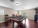 Game room with a pool table and hardwood floors at 1319 Johns Cove Ln, Oakland, FL 34787