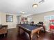 Finished game room with a billiard table, bar, and seating, perfect for entertaining at 1319 Johns Cove Ln, Oakland, FL 34787