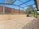 Enclosed patio featuring brick pavers, fireplace, and privacy wall at 1319 Johns Cove Ln, Oakland, FL 34787