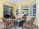 Cozy outdoor patio with a fire pit and comfortable seating arrangement at 1319 Johns Cove Ln, Oakland, FL 34787
