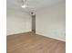 Vacant bedroom featuring a ceiling fan and wood laminate flooring at 13917 Fairway Island Dr # 931, Orlando, FL 32837