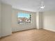 Bright bedroom with laminate wood floors and natural lighting at 13917 Fairway Island Dr # 931, Orlando, FL 32837