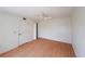 Bright bedroom with laminated floors, a ceiling fan, and closet, offering a cozy and neutral space at 13917 Fairway Island Dr # 931, Orlando, FL 32837