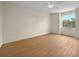 Bright, empty bedroom with wood floors and ceiling fan at 13917 Fairway Island Dr # 931, Orlando, FL 32837
