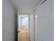The hallway has light-colored walls and multiple doors at 13917 Fairway Island Dr # 931, Orlando, FL 32837