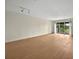 Bright living room with hardwood floors and sliding glass doors to a balcony, perfect for relaxation at 13917 Fairway Island Dr # 931, Orlando, FL 32837