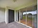 Large patio with sliding doors, door to storage and nice views at 13917 Fairway Island Dr # 931, Orlando, FL 32837