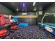 This home features a unique arcade room with an air hockey table and arcade games at 1403 Rolling Fairway Dr, Davenport, FL 33896