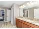 Bathroom featuring a double vanity with granite countertops and tile flooring at 1403 Rolling Fairway Dr, Davenport, FL 33896