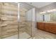 Bathroom showcases a glass-enclosed shower with tile surround and double vanity at 1403 Rolling Fairway Dr, Davenport, FL 33896