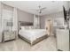 Serene bedroom with plush carpeting, a luxurious bed, and elegant furniture creating a comfortable retreat at 1403 Rolling Fairway Dr, Davenport, FL 33896