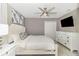 Bedroom featuring a queen bed, TV, and dresser, plus a ceiling fan, and carpet flooring at 1403 Rolling Fairway Dr, Davenport, FL 33896